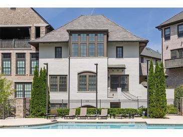 Beautiful home with a private pool and lounge chairs, perfect for relaxation at 6739 Encore Blvd, Atlanta, GA 30328