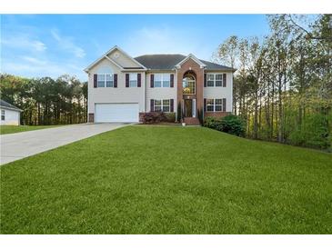 Charming two-story home with a well-manicured lawn and inviting curb appeal at 15 Glen Echo Dr, Covington, GA 30016
