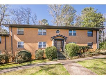 Charming brick multifamily home featuring well-maintained landscaping and a welcoming entrance at 1010 Scott Blvd # D8, Decatur, GA 30030