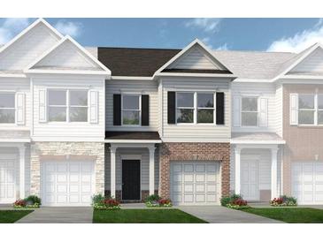 Charming townhome with brick and siding, offering a welcoming entrance and well-maintained landscaping at 317 Skye Ln # 51, Cartersville, GA 30121