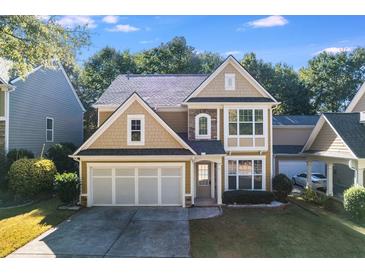 Two-story home boasting an attached garage, and neutral color palette with an inviting front entrance at 3277 Wyesham Cir, Duluth, GA 30096