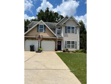 Charming two-story home with a two-car garage and a basketball hoop in the driveway at 398 Kyles Cir, Hiram, GA 30141