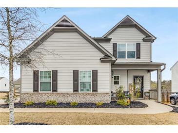 Charming two-story home with gray siding, brick accents, and a well-maintained front yard at 224 Shoals Bridge Rd, Acworth, GA 30102