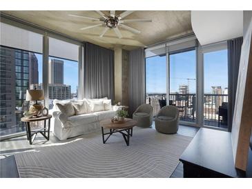 Bright living room with floor to ceiling windows, neutral decor, and city views at 855 Peachtree Ne St # 1703, Atlanta, GA 30308