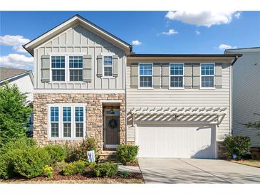 Charming two-story home with stone accents, well-maintained landscaping, and a welcoming entrance at 273 Amylou Cir, Woodstock, GA 30188