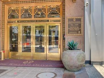 Ornate gold doors mark the William-Oliver Building Residences' entrance, established in 1930 and registered as a historic place at 32 Peachtree Nw St # 705, Atlanta, GA 30303