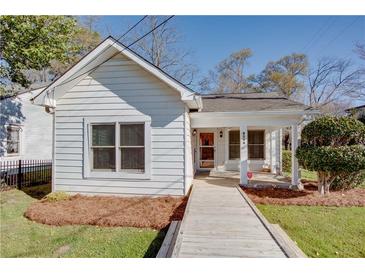 Charming one-story home featuring a welcoming front porch and well-maintained landscaping at 1627 Walker Ave, College Park, GA 30337