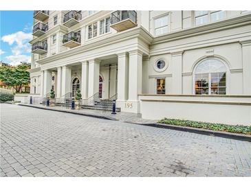 Grand building entrance with white columns and beautiful landscaping, number 195 at 195 14Th Ne St # Ph 306, Atlanta, GA 30309