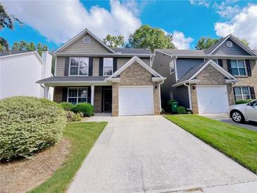 Charming townhome with attached garage and well-maintained lawn at 1421 Gates Se Cir, Atlanta, GA 30316