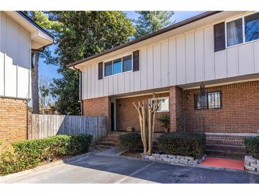 Charming exterior view featuring a brick facade and well-maintained landscaping, offering a welcoming curb appeal at 2516 Bradford Ne Sq, Atlanta, GA 30345