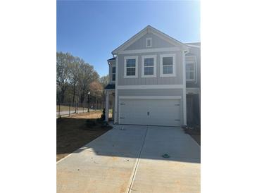 Charming two-story home with a two-car garage and a spacious driveway at 5193 Longview Run, Decatur, GA 30035