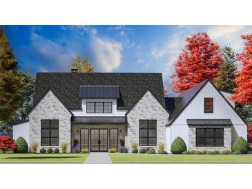Beautiful two-story home featuring a brick and white-wood exterior, black-trimmed windows, and manicured landscaping at 1276 B Rutledge Rd, Acworth, GA 30101
