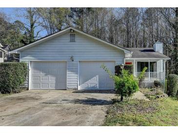 Charming single Gathering home with a two-car garage and a covered front porch at 3960 Rocmar Dr, Snellville, GA 30039