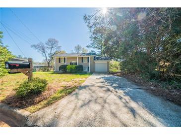 Charming two-story home features a driveway, mailbox, and classic design with a cozy, inviting curb appeal at 4205 Whittier Ct, Decatur, GA 30034