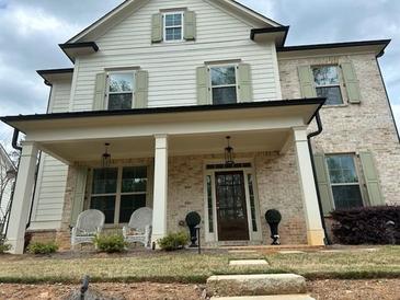 Charming two-story home with a brick facade and covered front porch at 812 Newsome Nw Aly, Marietta, GA 30064