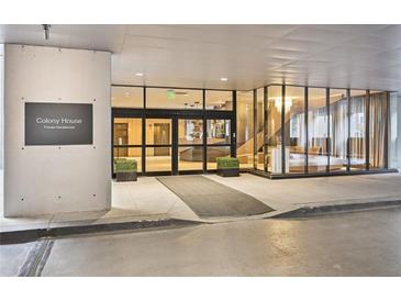 Modern building entrance featuring glass walls and automatic doors, showcasing sleek design and accessibility at 145 15Th Ne St # 204, Atlanta, GA 30309