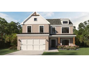 Charming two-story home with brick facade, symmetrical design, and manicured landscaping at 372 Waterbluff Dr, Mableton, GA 30126