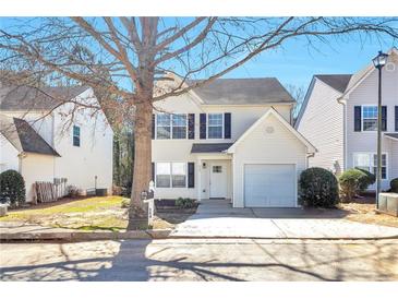 Charming two-story home with white siding, black shutters, and a well-maintained front yard at 344 Springbottom Ct, Lawrenceville, GA 30046