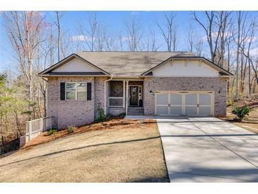 Charming brick home with two-car garage, front porch, and well-maintained lawn, perfect for a growing Gathering at 197 Saddleridge Dr, Bremen, GA 30110