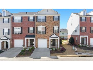Charming brick townhome with well-maintained landscaping and attached garage at 3540 Chattahoochee Summit Se Ln # 28, Atlanta, GA 30339