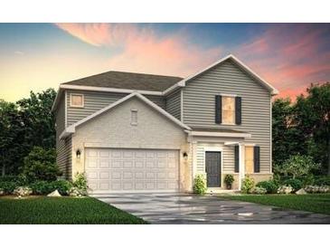 Charming two-story home featuring a brick and siding exterior with a two-car garage at 8517 Polston Place Lot 135, Douglasville, GA 30134