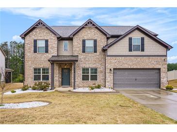 Charming brick two-story home featuring a two-car garage and well-maintained landscaping at 224 Osier Dr, Mcdonough, GA 30252