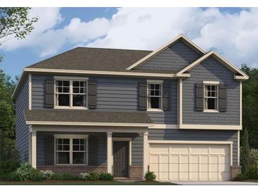 Charming two-story home featuring blue siding, decorative shutters, and an attached two-car garage at 604 Blue Sky Blvd, Acworth, GA 30102