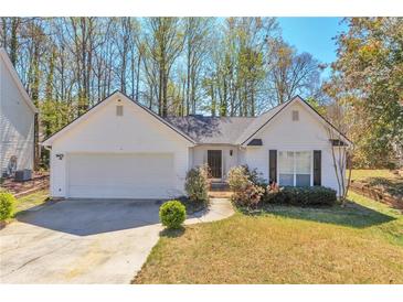Charming single-story home with attached garage and well-maintained front yard at 2220 Golden Valley Dr, Lawrenceville, GA 30043