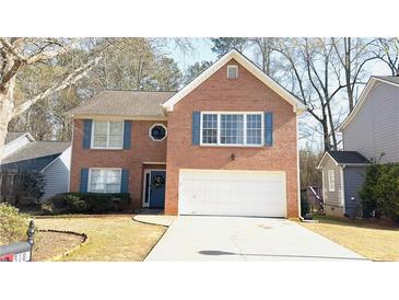 Charming two-story brick home with a two-car garage and well-manicured landscaping at 3185 Haverhill Rowe, Lawrenceville, GA 30044