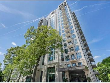 Modern condo building featuring balconies and large windows, surrounded by mature trees at 2520 Peachtree Rd # 602, Atlanta, GA 30305
