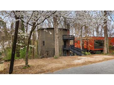 Unique home design with multi-level decks nestled among the trees at 595 Overbrook Nw Dr, Atlanta, GA 30318
