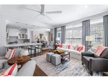 Elegant living room featuring an open floor plan, stylish furniture, and bright natural light at 2500 Peachtree Nw Rd # 207S, Atlanta, GA 30305