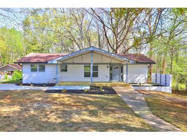 Charming brick home with a cozy front porch and newly landscaped front yard at 2248 Doris Dr, Decatur, GA 30034