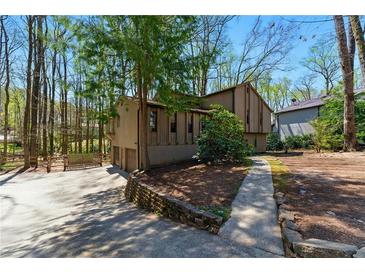 Unique multi-level home with attached garage and wooded lot at 3292 Holly Mill Ct, Marietta, GA 30062