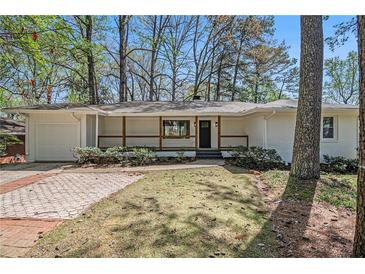 Charming, updated ranch with brick accents, manicured lawn and covered porch at 1863 Bruce Ne Rd, Atlanta, GA 30329