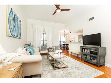 Bright living room featuring hardwood floors, neutral walls, and stylish decor with lots of natural light at 3777 Peachtree Ne Rd # 1530, Atlanta, GA 30319