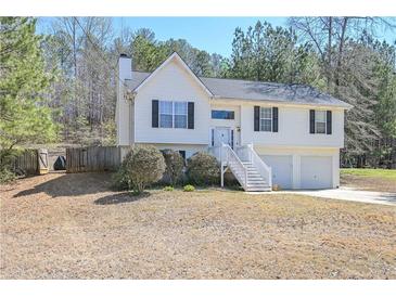 Charming home featuring a traditional design, a two-car garage, and a inviting front yard at 114 Connie Dr, Dallas, GA 30157