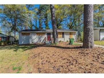Charming single-story home with trees and lawn at 388 Belgarde Se Pl, Atlanta, GA 30354