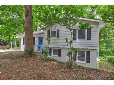Charming exterior view of home featuring a bright blue front door and black shutters at 2270 Cresta Dr, Decatur, GA 30032