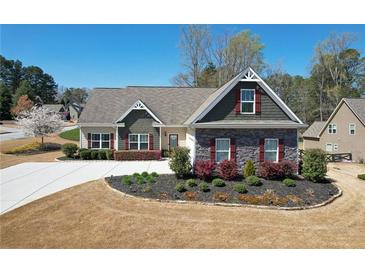 Charming single-Gathering home featuring a well-manicured lawn and mature landscaping at 15 Azalea Lakes Ct, Dallas, GA 30157