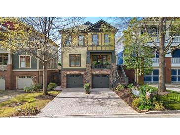 Charming two-story home with a brick facade, a two-car garage, and manicured front yard at 1125 Francis Ne St, Brookhaven, GA 30319