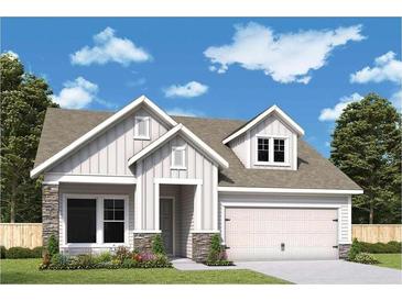 Charming home with a stone accent and a well-manicured lawn, perfect for curb appeal at 2055 Ripple Park Bend, Canton, GA 30114
