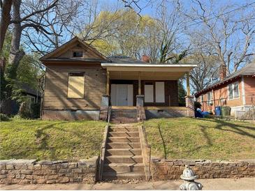 Exterior of home with front steps leading to the front door and yard at 707 Dill Sw Ave, Atlanta, GA 30310