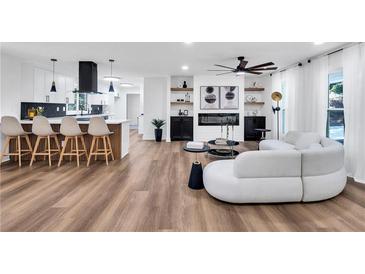 Bright living room features a modern kitchen, fireplace, and stylish seating for a cozy and inviting space at 2615 Holly Ln, Marietta, GA 30062