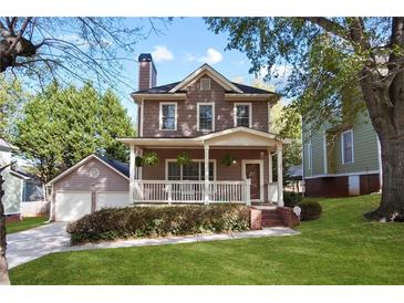 Charming two-story home with a welcoming front porch and well-maintained landscaping at 109 Bowen Sw Cir, Atlanta, GA 30315