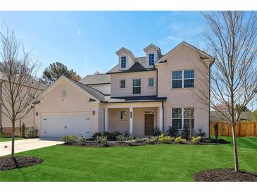 Beautiful two-story home with a well-manicured lawn and attached two car garage at 4257 Freight St, Tucker, GA 30084