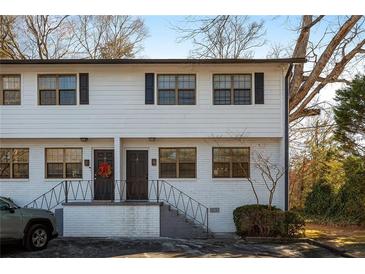 Charming two-story home with brick accents, updated windows, and a welcoming entryway at 1687 Briarcliff Ne Rd # 8, Atlanta, GA 30306