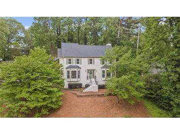 Charming two-story home with a landscaped yard and a welcoming front entrance at 1945 Wenlok Ne Trl, Marietta, GA 30066