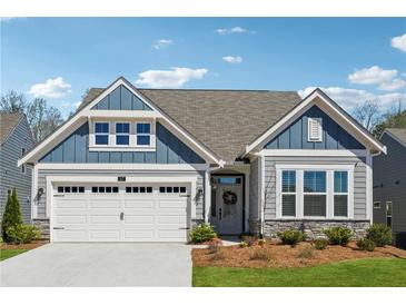 Charming single-Gathering home with a well-manicured lawn, two car garage, and inviting front entrance at 67 Narrowleaf Ln, Dallas, GA 30157