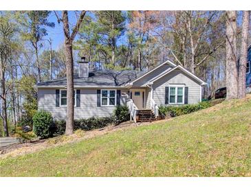 Charming single-story home with well-maintained lawn, inviting entrance, and a cozy, traditional style at 2228 Arbor Forest Sw Trl, Marietta, GA 30064
